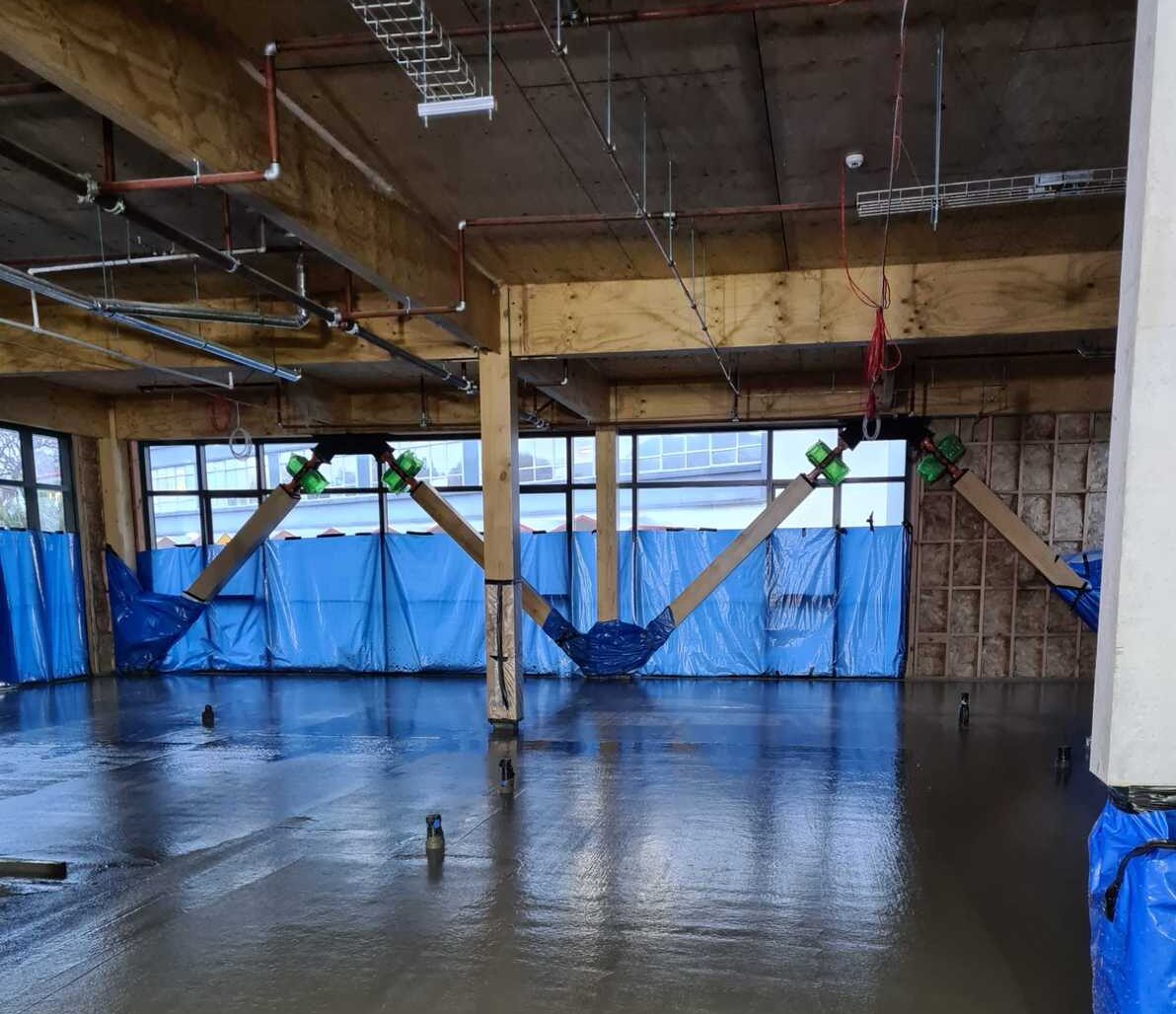 Concrete floor being poured during light commercial construction project in Wellington.