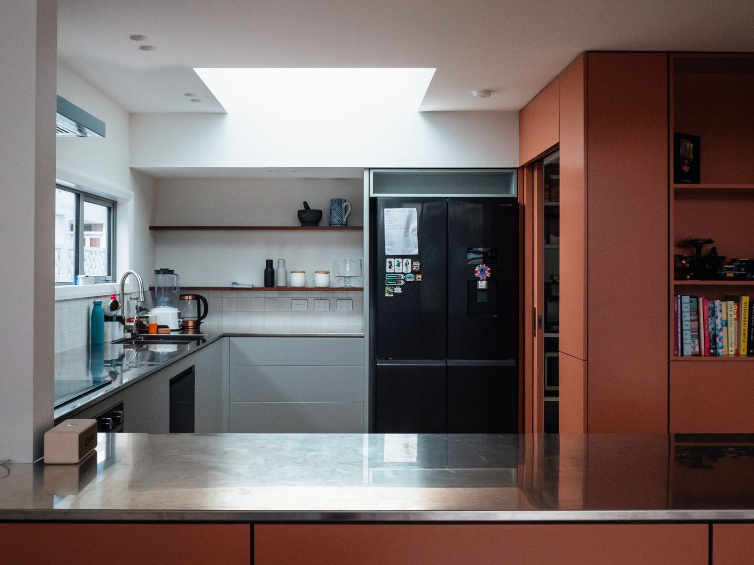 Modern kitchen renovation in a 1901 Thorndon villa by Clearcut Building Solutions, featuring custom cabinetry, skylight, and contemporary finishes.