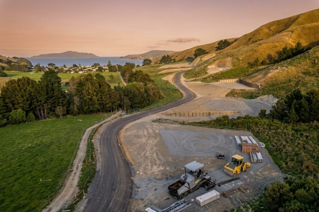 Aerial view of The Glen subdivision road construction at Grays Road Pauatahanui with coastal views